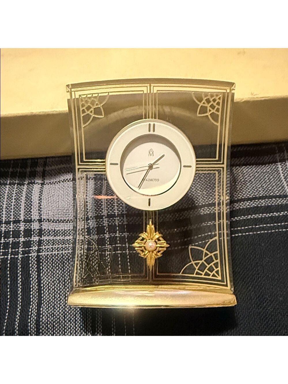 vintage Mikimoto desk clock featuring a decorative Akoya pearl.